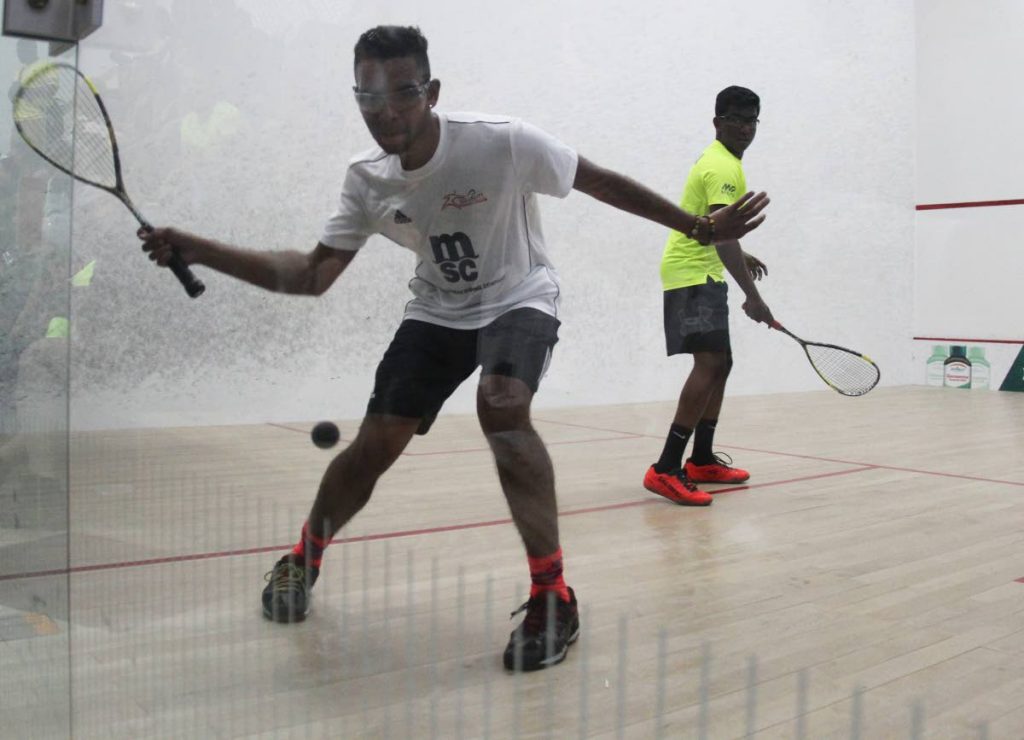 Kobie Khan of TT, left, and Daniel Islam of Guyana in a match at the 2019 Junior Caribbean Area Squash Association (CASA) Championships at the Queen’s Park Indoor Racquet Centre in St Clair
PHOTO BY AYANNA KINSALE 2019.07.18