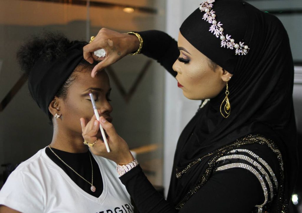 BEFORE: Make-up artist Amiela Razzaq displays her skills on model Kimi Paul at the Covergirl launch of its new line at Vas Lounge, St Clair.

PHOTO:ANGELO M. MARCELLE
19-07-2019