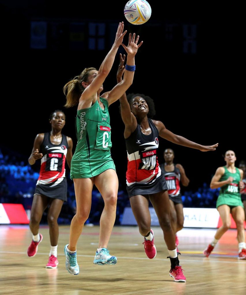 Northern Ireland's Caroline O'Hanlon, centre, in action against TT during the Netball World Cup match in Liverpool, England, today. (via AP)