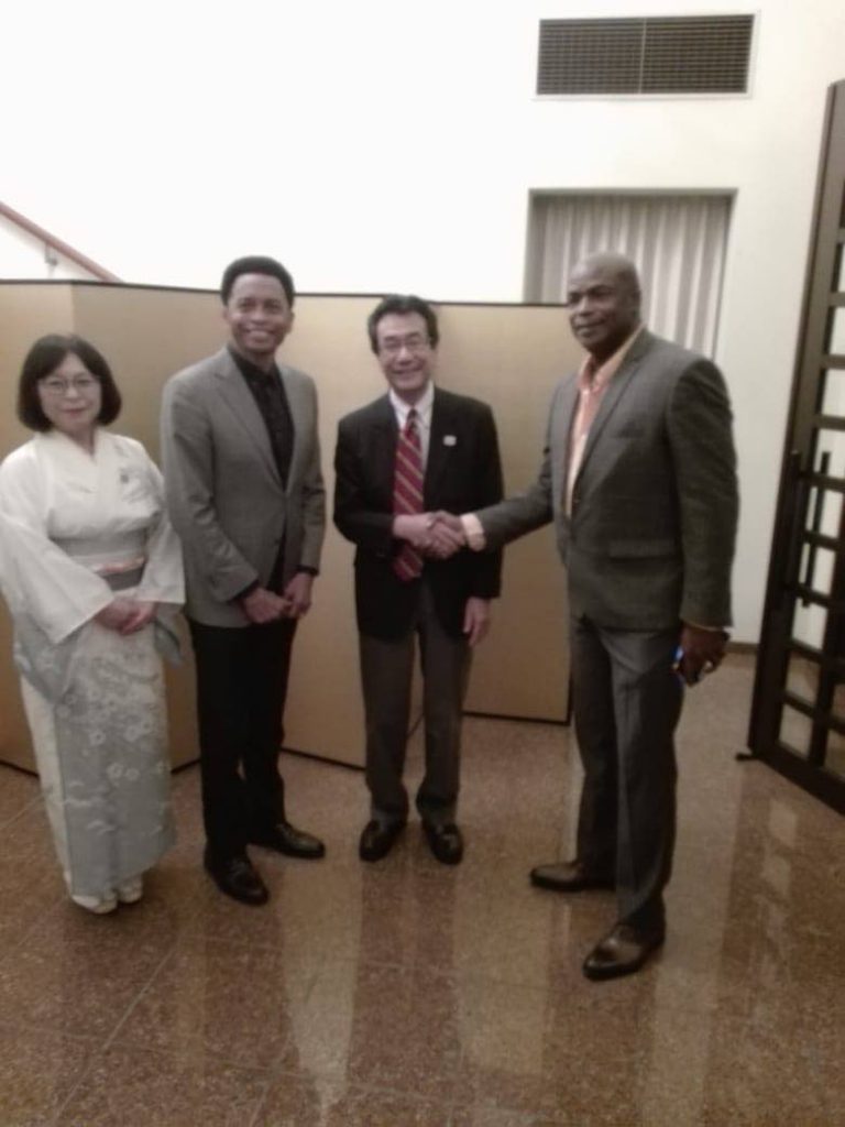 TT's first Olympic gold medallist Hasely Crawford,right, shakes hands with Ambassador to Japan Tatsuo Hirayama, at a Tokyo Olympic Games 2020 countdown celebration, at the abassador's residence, in St Clair, on Friday evening. At right, wife of the amabassador Sachiko Hirayama and TT Olympic president Brian Lewis look on.