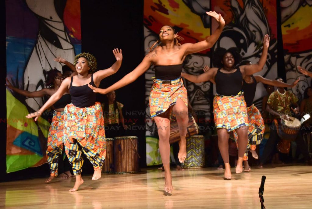 UWI Afrikan Society members perform a West African dance during Aya, at UWI, St Augustine.

 PHOTOS BY AYANNA KINSALE
