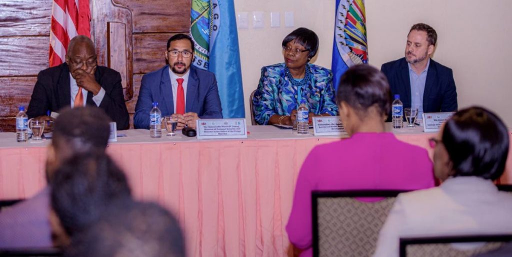 Chief Secretary Kelvin Charles, seated left, alongside National Security Minister Stuart Young, second from left, Health Secretary Dr Agatha Carrington, second from right, and US Embassy political officer Jason Hammontree, right, at the opening ceremony for the adolescent drug intervention training programme, last Tuesday at Mt Irvine Bay Resort. PHOTO BY DAVID REID