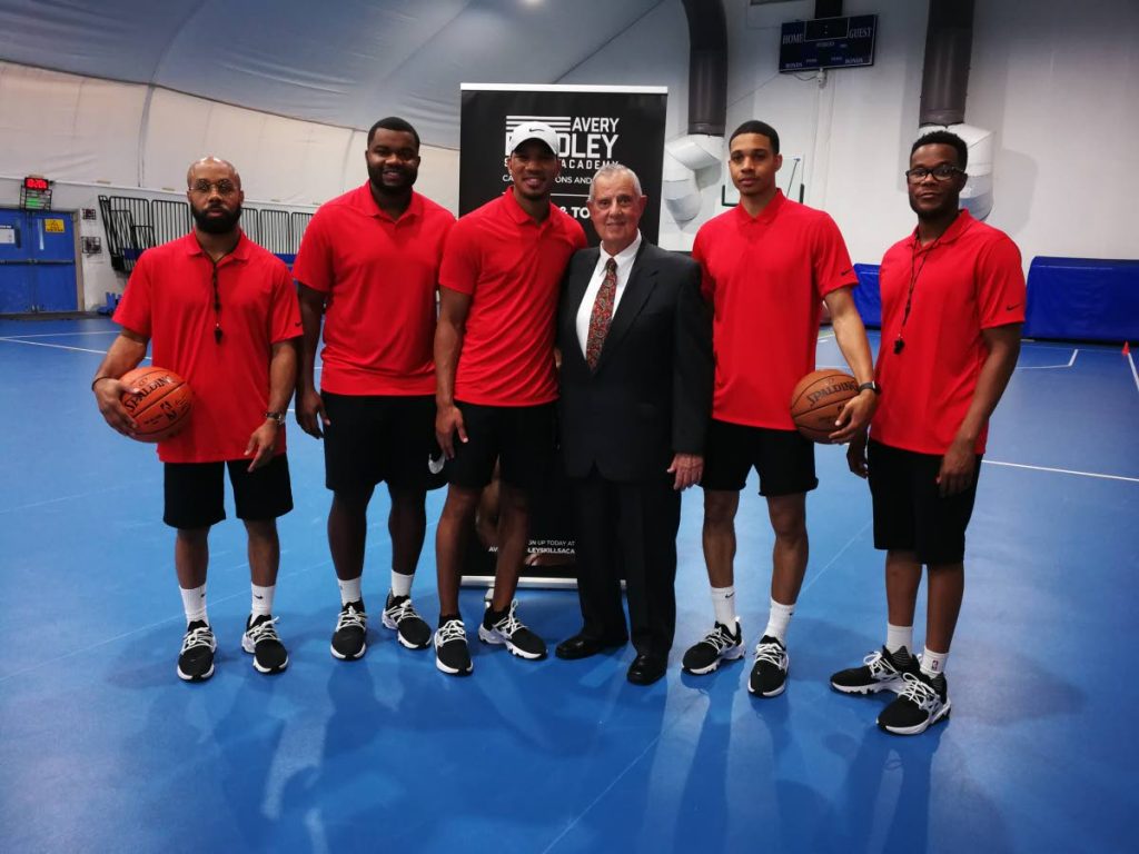 NBA star Avery Bradley (third from left), with US Ambassador Joseph Mondello in suit, with other coaches from left, Chad Patterson, Justin Mason, Abdul Gaddy and Tim Mack, during a recent session.