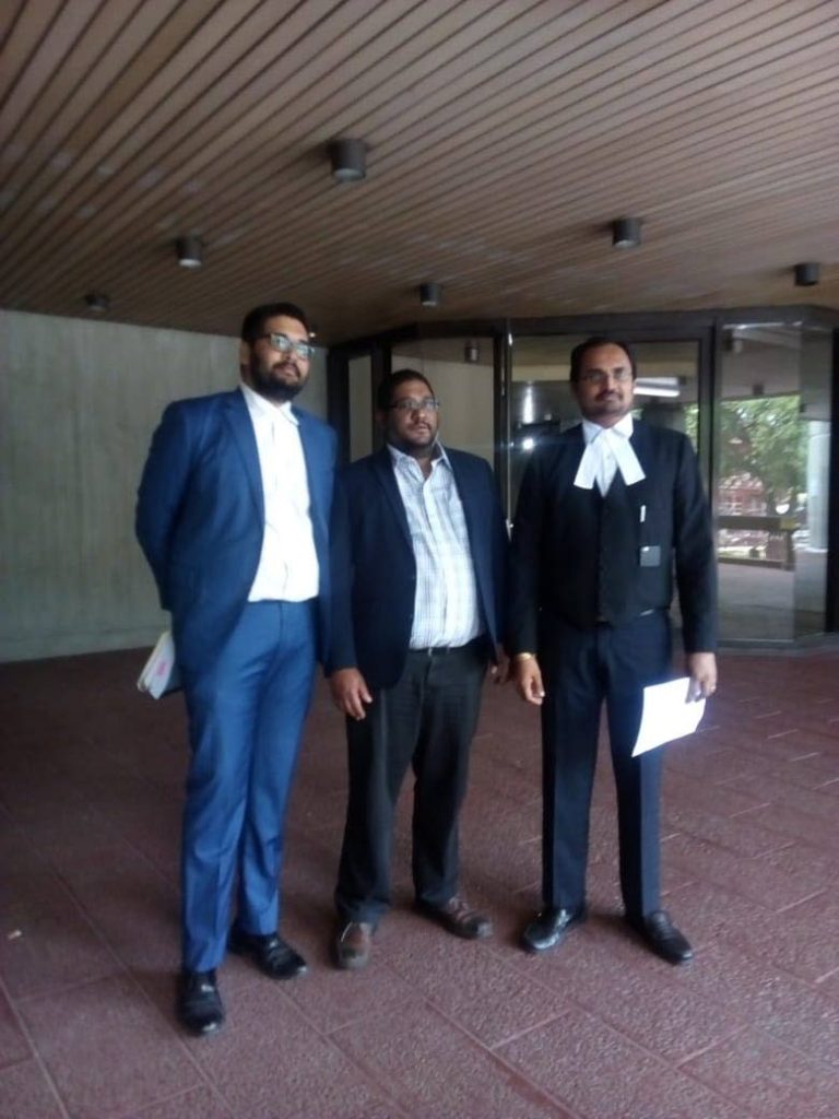 HIGH COURT WIN: Central Broadcasting Services Ltd - parent company for Radio and TV Jaagriti - Lokesh Maharaj, centre, with the company's attorneys Stefan Ramkissoon, left, and Dinesh Rambally, right, at the Hall of Justice, Port of Spain. CBSL won its case against the Police Commissioner over a search warrant.