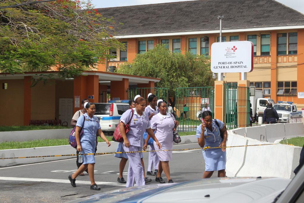 A group of nurses walk past police caution tape on July 24, 2015. File photo