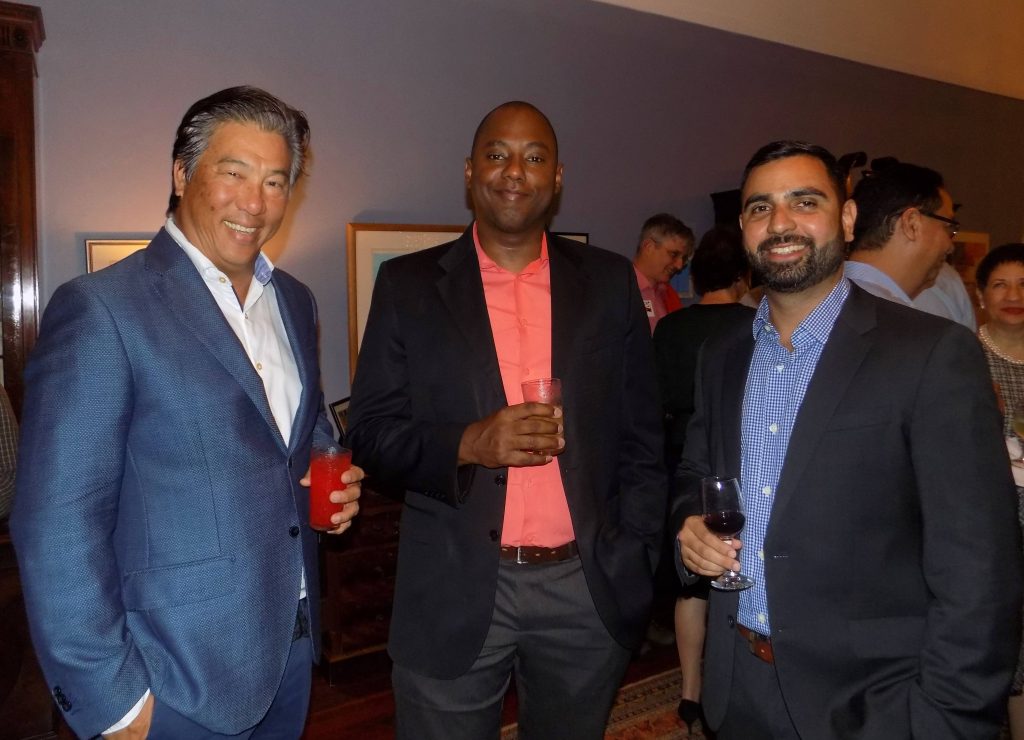 Businessman Howard Chin Lee, left, Haydyn Gadsby of JD Sellier and Assistant Managing Director of Dumore Enterprises Ltd Alex Jodhan pose for a picture during a cocktail reception at the British High Commissioner's residence in January.