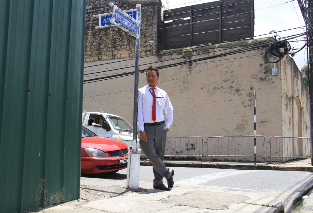 Newsday reporter Shane Superville stands outside the Port of Spain Prison. Photo by Ayanna Kinsale