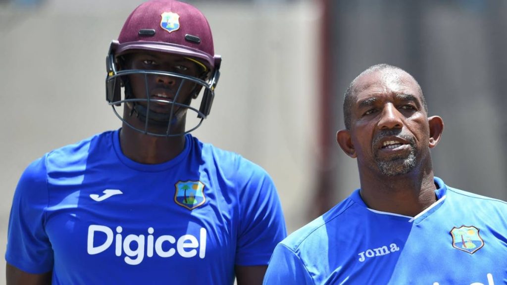 Former West Indies coach Phil Simmons (right) alongside Test and ODI captain Jason Holder. 