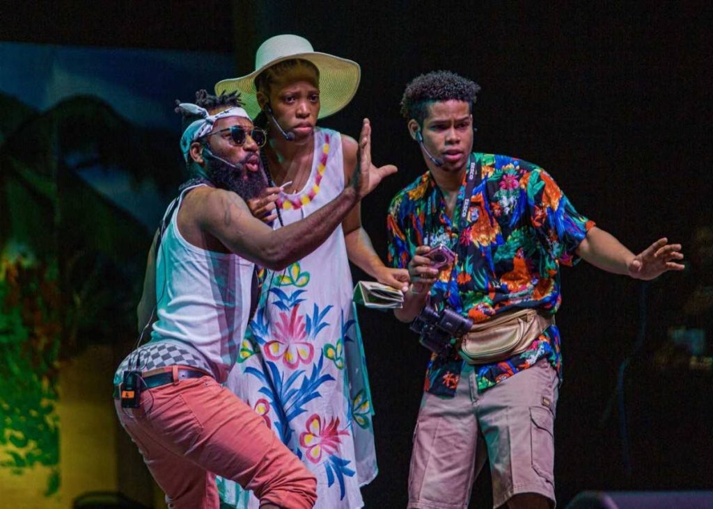 Anton Roberts (left) acts as Eric the tour guide who took American visitors, played by Britni Brooks (centre) and Daniel Perreira, on a Tobago experience tour.  The skit was done at the opening of the 2019 Tobago Heritage Festival. PHOTO BY DAVID REID 