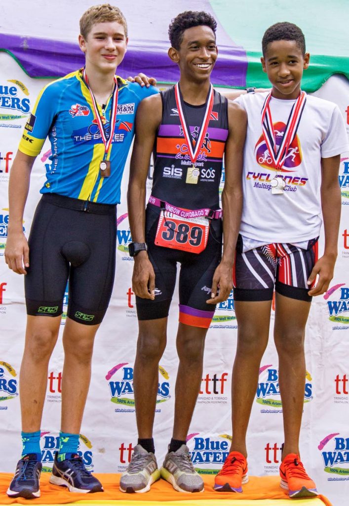 Graeme Waithe Toussaint (centre) overall male winner of the TT Triathlon Federation's National Duathlon, dash category, is joined on the podium by Justin Boynes (right) who placed second and James Castagne-Hay, who placed third. All three are on the national Carifta team. PHOTO BY MELANIE WAITHE