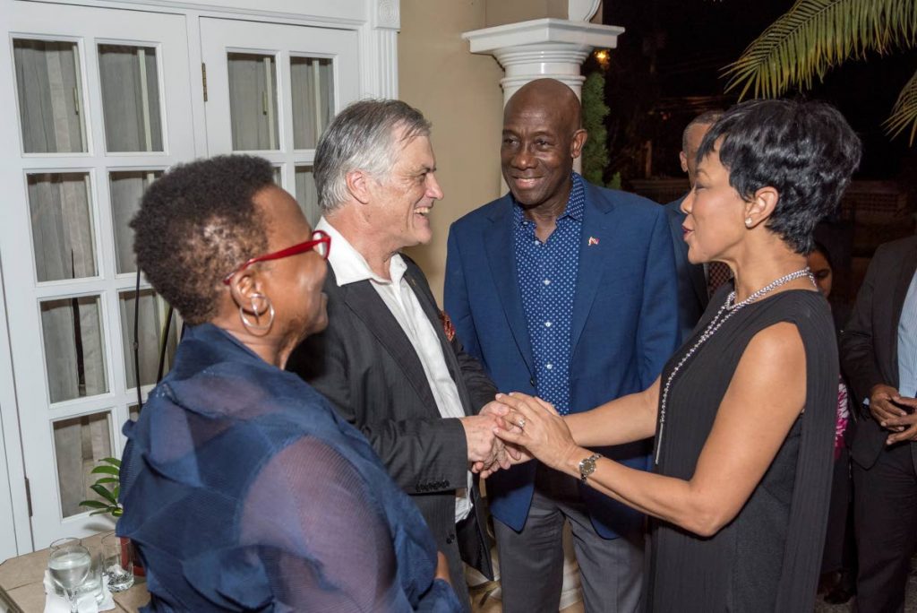 Australian High Commissioner John Pilbeam and his spouse  Yvonne Webber greet Prime Minister Dr Keith Rowley and Sharon Rowley.