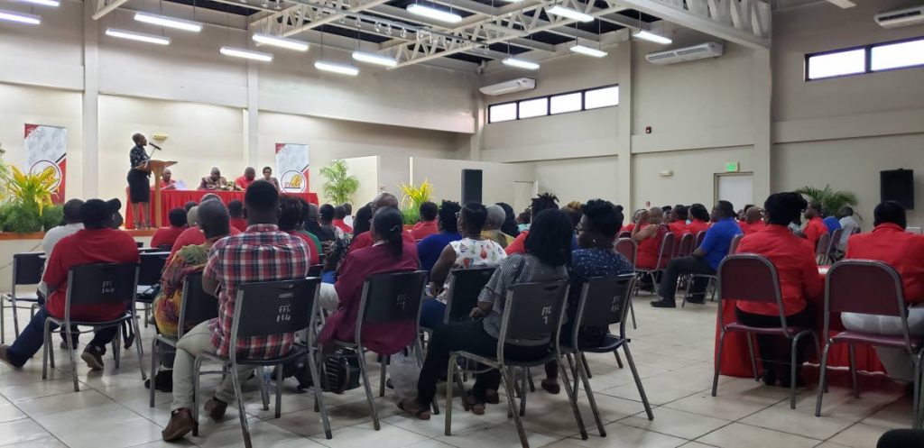 PNM members listen as emcee Melissa James-Guy speaks during a constituency meeting at Lowlands Multipurpose Facility on Tuesday. 