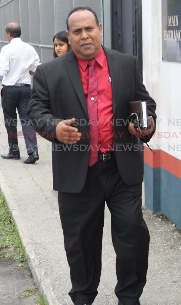 Snr Supt ag,  Samuel Seepersad leaving the Chaguanas magistrates court charged with harassment.



Photo: Lincoln Holder   