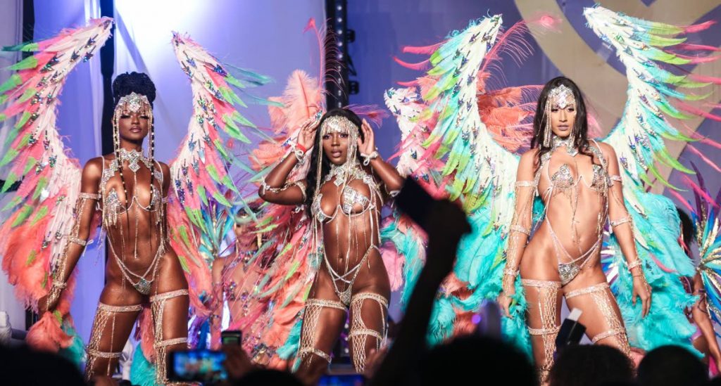 COLOUR IN MOTION: Models show off their costumes at the launch Yuma Vibe's 2020 Carnival presentation, Fete, at the Hasely Crawford Stadium in Port of Spain.  PHOTO BY JEFF K MAYERS