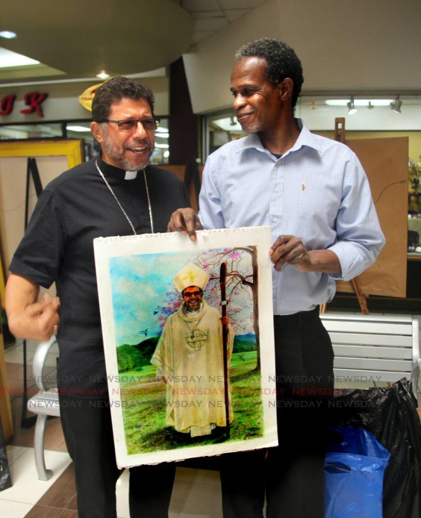 Archbishop Jason Gordon was somewhat suprise to find out that prisoner Cleophus Maynard drew a painting of him at the TT Prison Service  10th annual Inmates Art Exhibition in collaboration with the Raja Yoga Prison Ministry at Long Circular Mall in St James.. PHOTO SUREASH CHOLAI