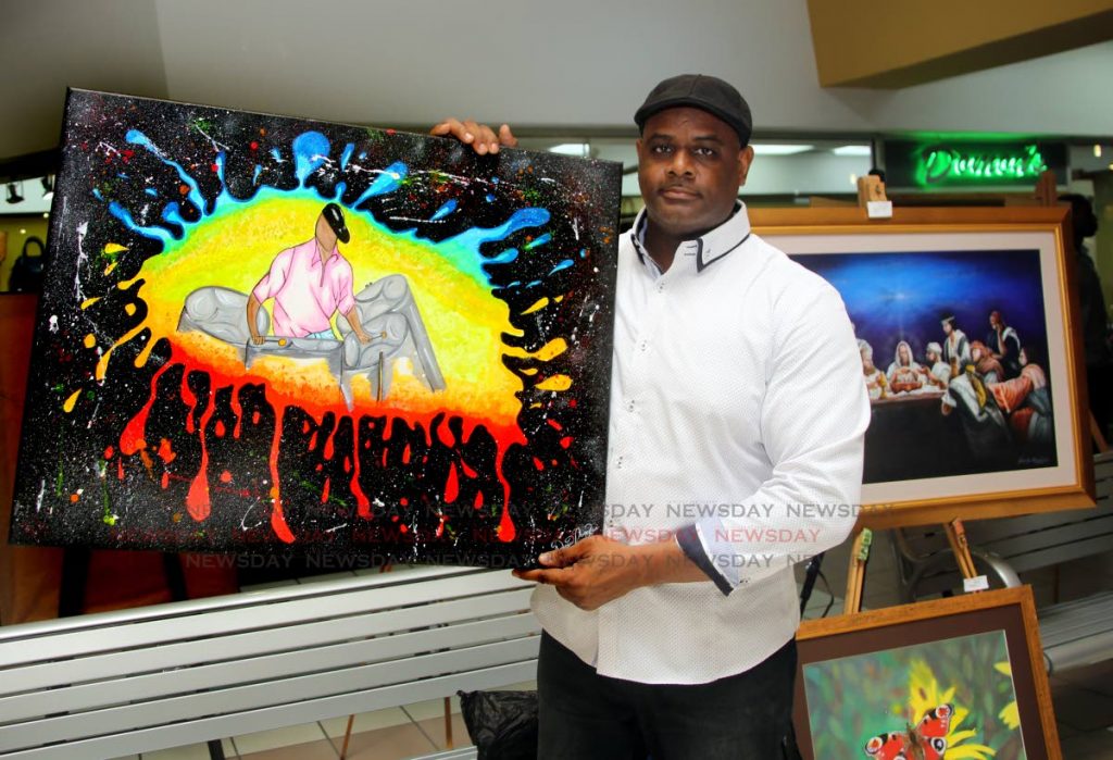 Inmate Andrew Douglas displays his painting Cultural Explosion.