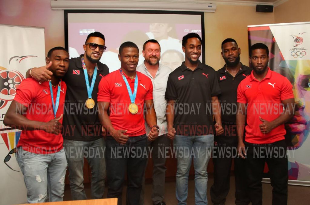 TT cyclists and staff at the TT Olympic House in Port of Spain, on Wednesday, after returning from the 2019 Pan American Games in Lima, Peru. Keron Bramble, from left, Njisane Phillip, Nicholas Paul, technical director Erin Hartwell, Jabari Whiteman, mechanic Elijah Greene and Kwesi Browne. PHOTO BY SUREASH CHOLAI