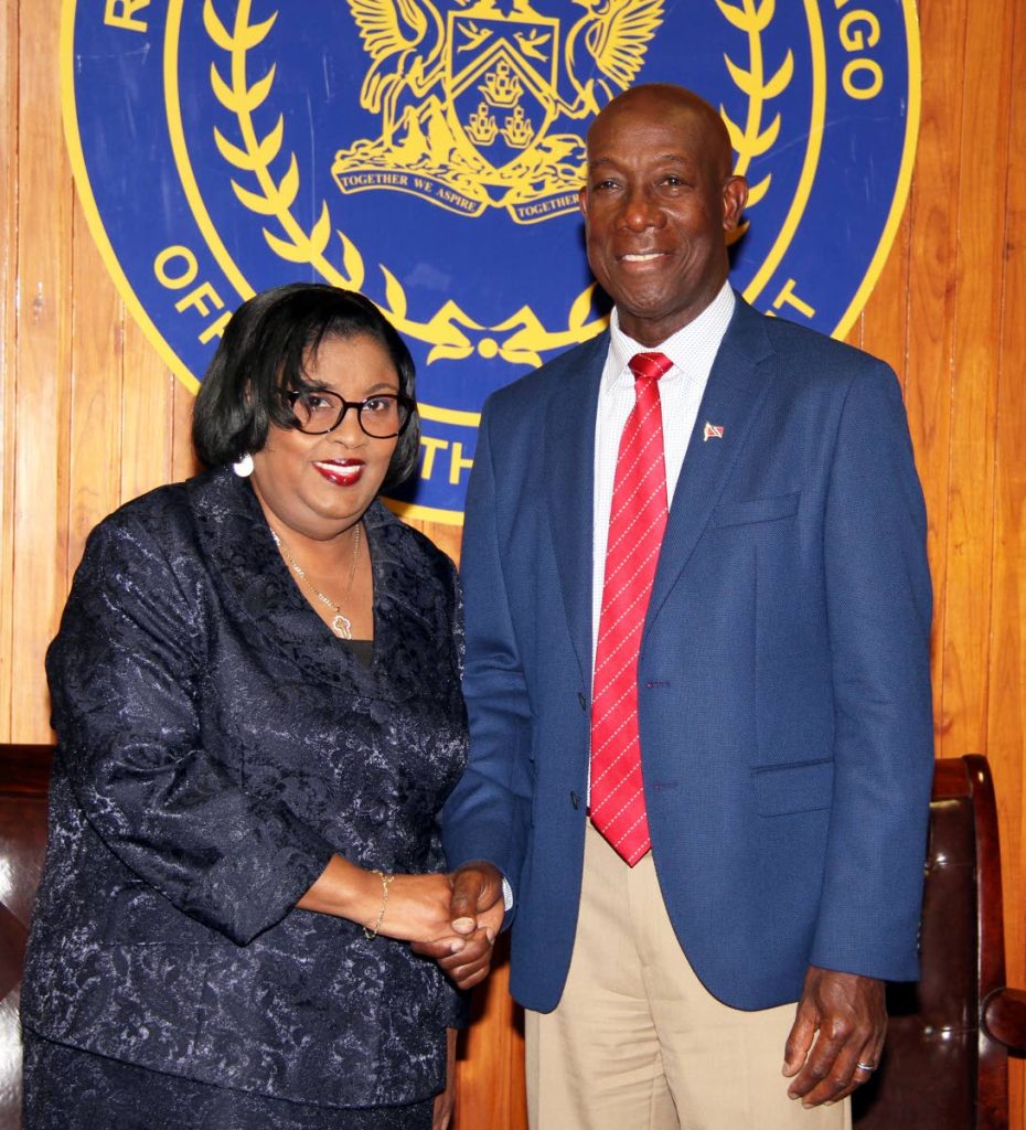 File photo: PM Dr Keith Rowley congratulating Marlene Mc Donald  after took the oath of  as Minister in the Ministry of Public Administration and Communications at the Office of the President in St Ann's in 2018.

 PHOTO SUREASH CHOLAI