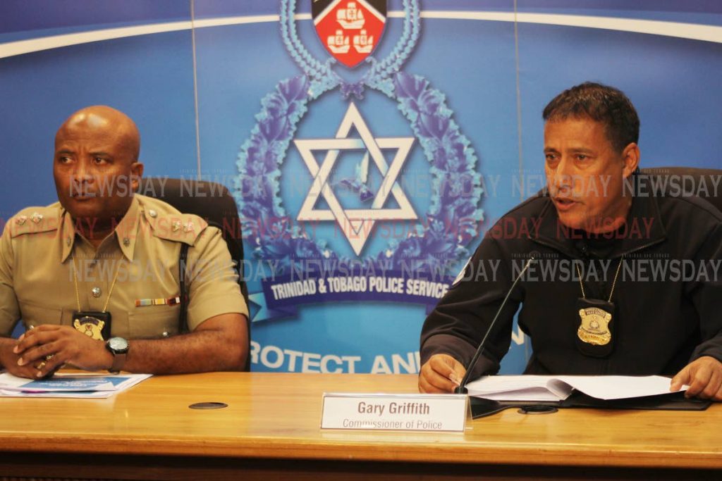 Commissioner of Police Gary Griffith, right and public information officer Supt (ag) Wayne Mystar, address the media at the Police Administration Building, Port of Spain, on Friday. PHOT BY ANGELO MARCELLE