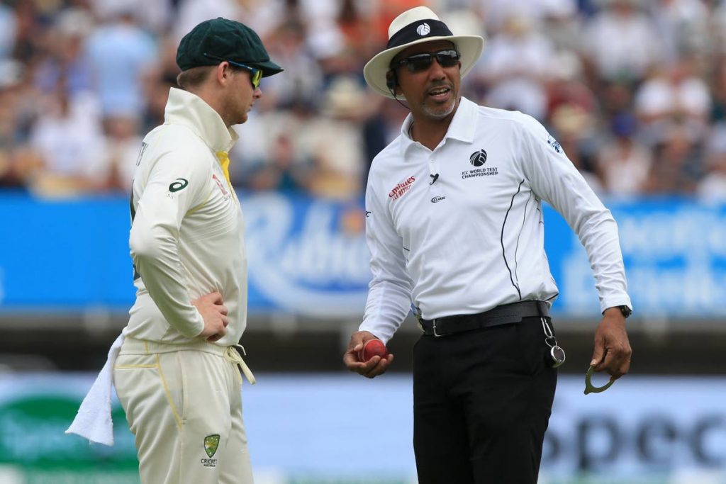 In this August 3 file photo, umpire Joel Wilson checks the shape of the ball as Australia’s Steve Smith (L) looks on during play on the third day of the first Ashes Test between England and Australia at Edgbaston in Birmingham, central England.