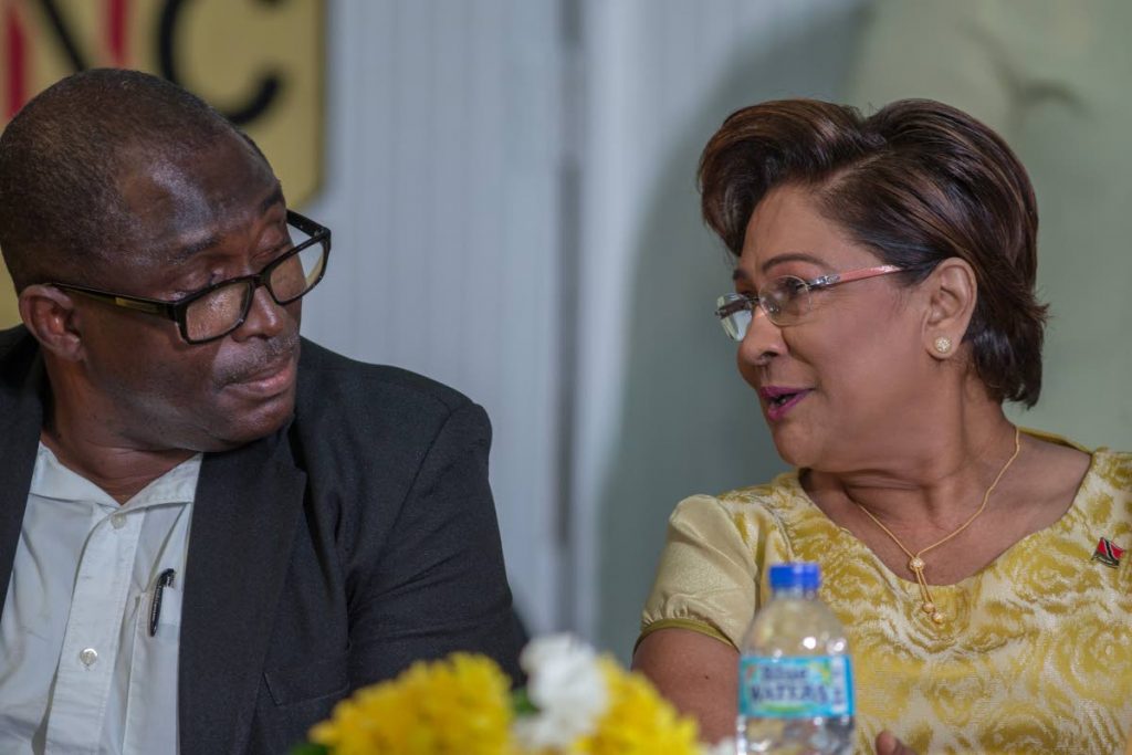 UNC political leader Kamla Persad-Bissessar and former Strategic Services Agency director of intelligence Carlton Dennie, speak at the party’s Monday Night Forum at the Debe High School.  PHOTO BY JEFF K MAYERS