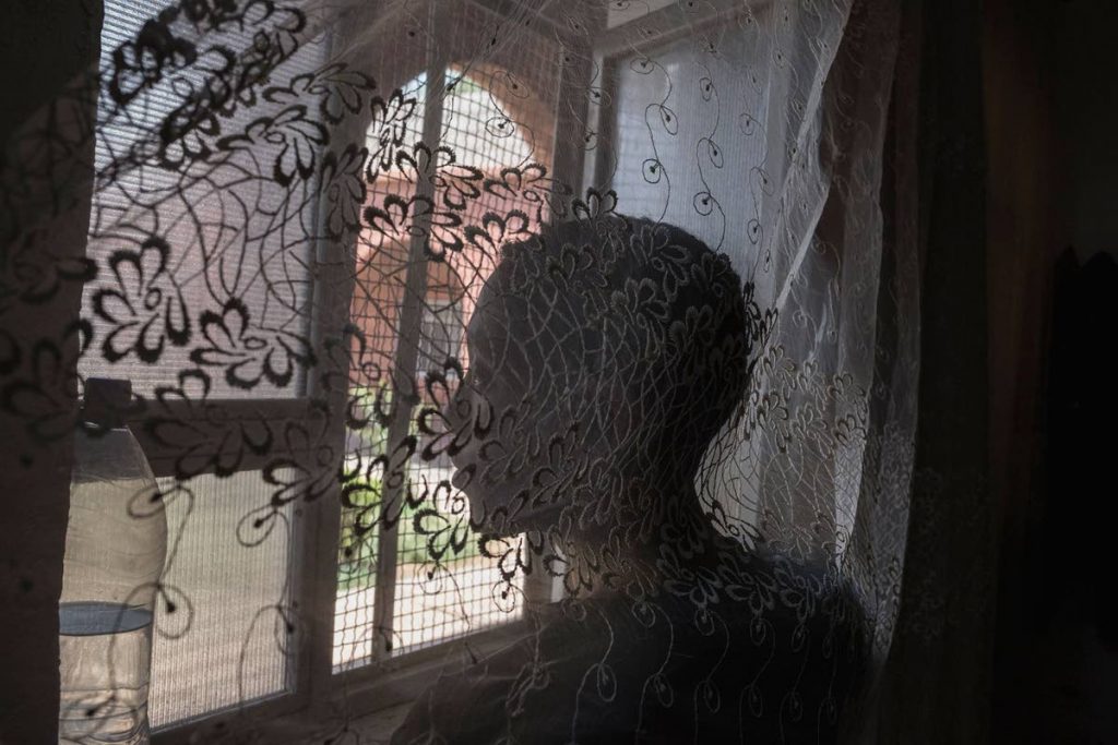 Sulay Su, 16, looks out a detention centre in north-eastern Syria