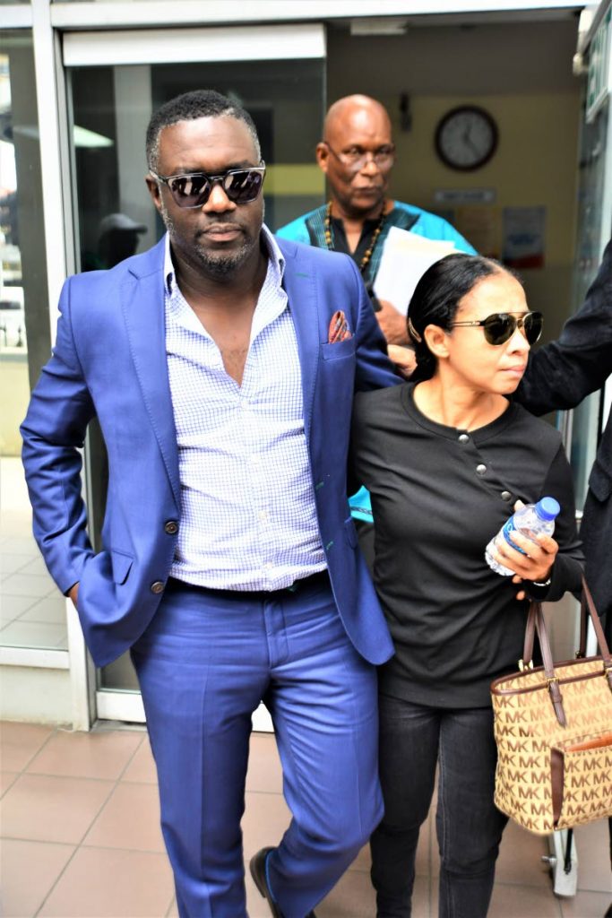 PSA president Watson Duke leaves Port of Spain Magistrates' Court with his wife Kim after he appeared on a sedition charge on Friday.