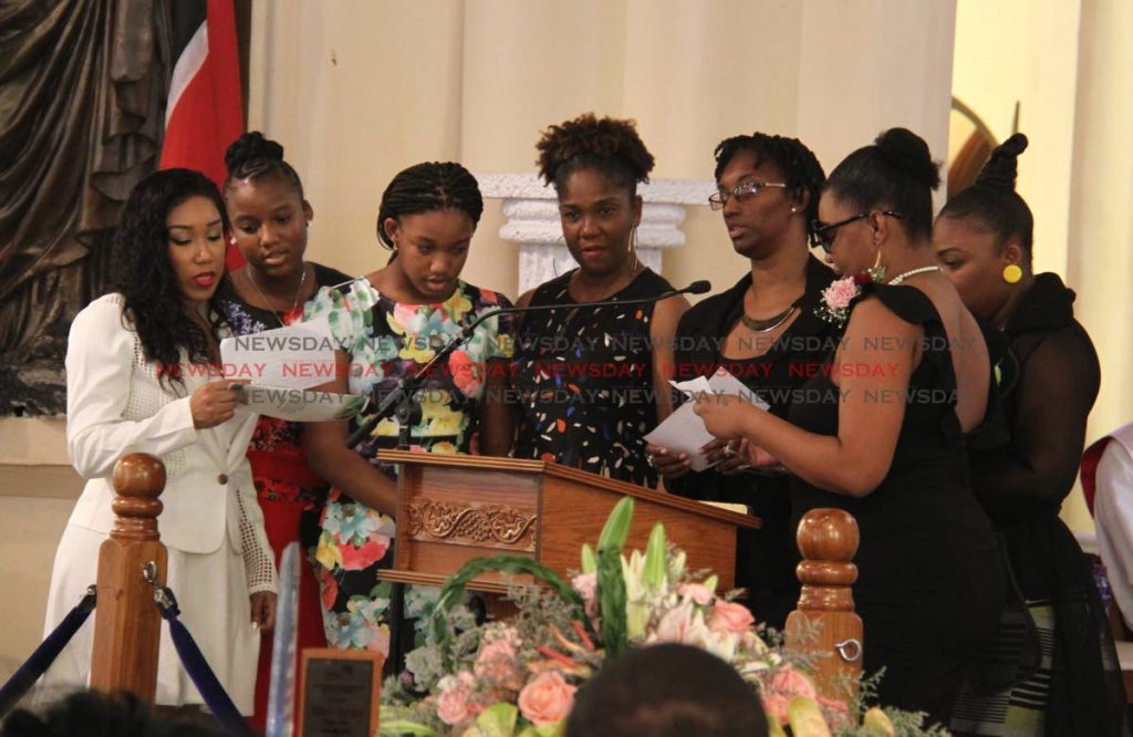 Family members pay tribute to former nurse Hermina Doughty during her funeral at the Cathedral of Immaculate Conception on Friday. PHOTO BY AYANNA KINSALE