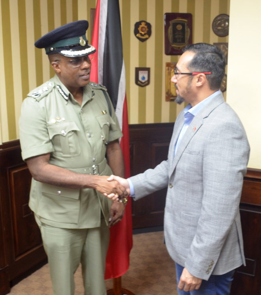 Minister of National Security the Honourable Stuart R. Young M.P. (right) congratulates Mr. Gerard Wilson (left) on his appointment as Commissioner of Prisons. Photo courtesy Ministry of National Security.
