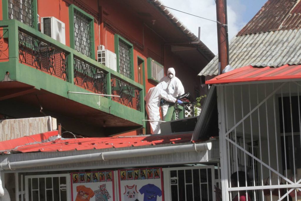 The body of Actor Raymond Choo Kong, is removed by undertakers from his Green Street, Arima home where he was found dead on Monday July 15, 2019. PHOTO BY ANGELO M MARCELLE