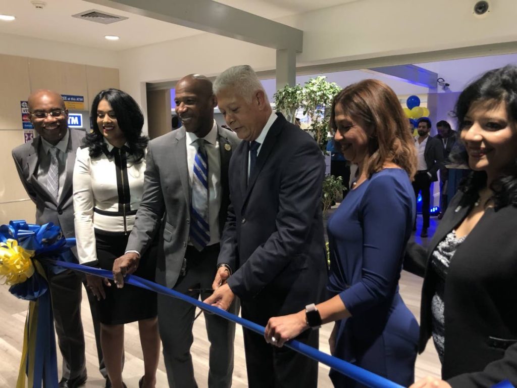 In this August 2019 file photo, Port of Spain Mayor Joel Martinez (third from right) cuts the ribbon to open RBC TT’s new digitally-enabled branch in Maraval, along with (from left) Central Bank’s Patrick Solomon, RBC Maraval branch manager Jenelle Alexander-Ramkissoon, RBC Financial CEO Darryl White and RBC TT managing director Gretchen Camacho-Mohammed.