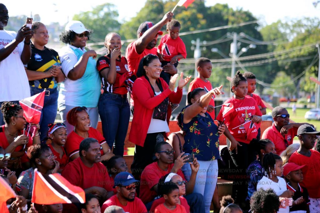 Cheering Trinis: Spectators cheer during the Independence Day parade at Queen’s Park Savannah, Port of Spain. 