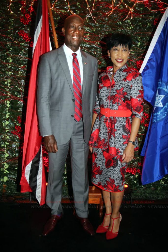 Together forever: Prime Minister Dr Keith Rowley and his wife Sharon during Independence Day celebrations at Police Administration Building, Port of Spain yesterday. PHOTO BY SUREASH CHOLAI