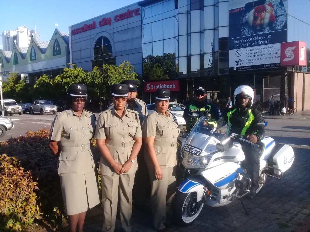 from left to right: Supt Jucila Jackman, ACP Joanne Archie, ACP David Guelmo, Sen Supt Sharon Gomez-Cooper from the Traffic and Highway Patrol, Aranguez,TTPS Road Safety coordinator Brent Batson and constable Bennet seated on a motorcycle at the Cipriani statue roundabout on Independence Square. 

PHOTO BY: Marlene Augustine