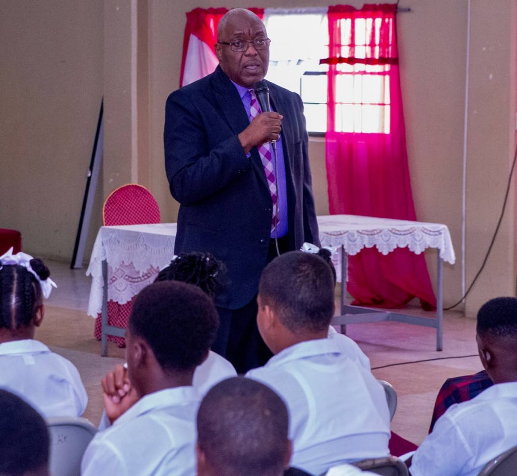 Chief Secretary Kelvin Charles praises students of Pentecostal Light and Life Secondary for raising the school's CXC pass mark from 24 per cent to 75 per cent. 