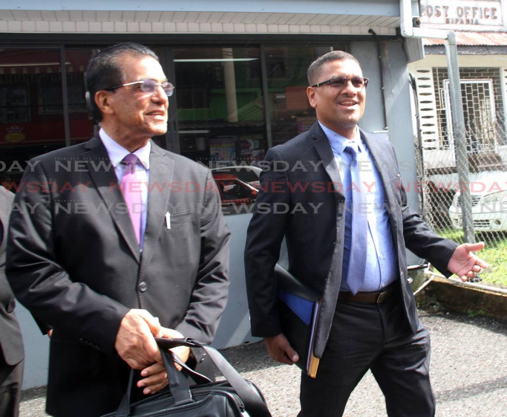 Billy Ramsundar, right, son in law of AV Drilling's Nazim Baksh leaves the Siparia Magistrate Court with attorney Ramesh Lawrence Maharaj on Tuesday. PHOTO BY VASHTI SINGH