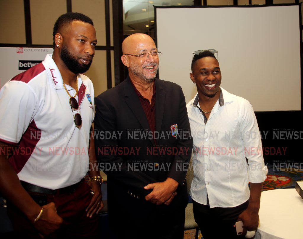 Kieron Pollard (from left)  Ricky Skerritt,  President of Cricket West Indies and  Dwayne Bravo,  during at press conference at Hilton Trinidad in which Pollard was name captain of the West Indies' one-day international and T20 teams . 

PHOTO SUREASH CHOLAI