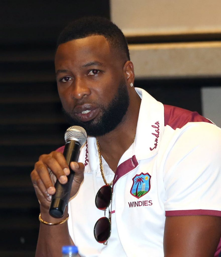 West Indies captain Kieron Pollard 
addresses the media yesterday, during a Cricket West Indies press conference, at the Hilton Trinidad.