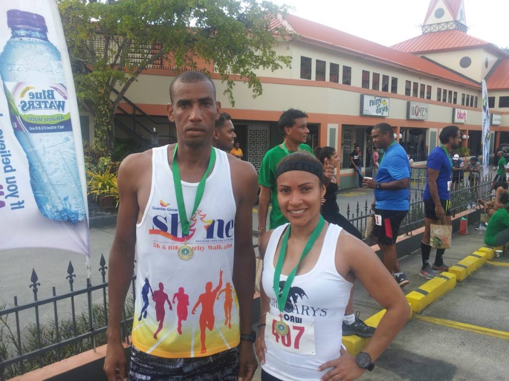 Winners of the 2018 Starbucks 5K event Lionel Dandrade, left, and Thais Gutierrez. The pair will not compete this year making room for new champions.