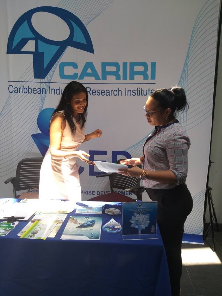 BUSINESS TALK: Officials from CARIRI were at the exporTT’s seminar on innovation on Wednesday at the Arthur Lok Jack Graduate School of Business in Champs Fleurs. 
PHOTO BY TYRELL GITTENS 