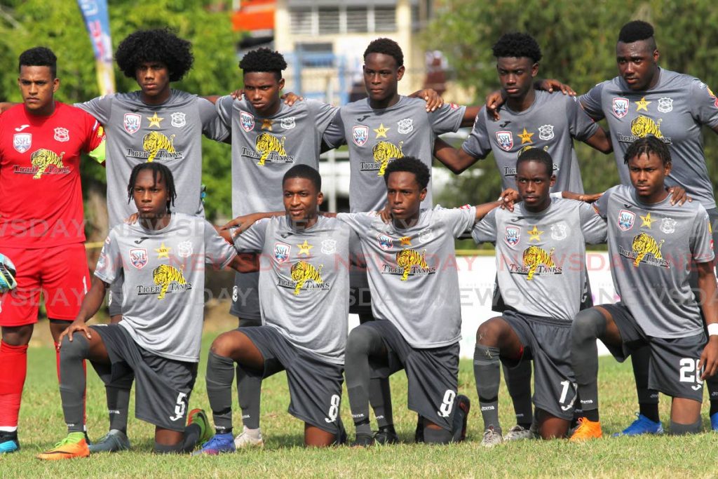 Members of the Naparima football team ahead of last Wednesday's match against St Mary's, at Lewis Street, San Fernando. PHOTO BY LINCOLN HOLDER