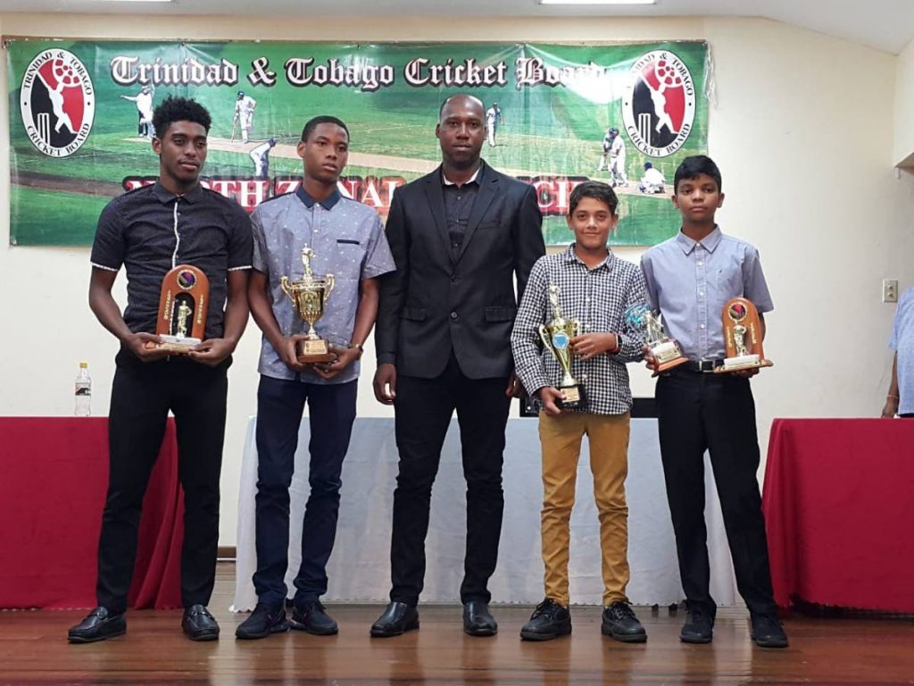 Youth MVPs Giovanni Letren, from left, Chadeon Raymond, Joshua Davis and Rahul Lakhan, along with national cricketer Marlon Richards, middle.
