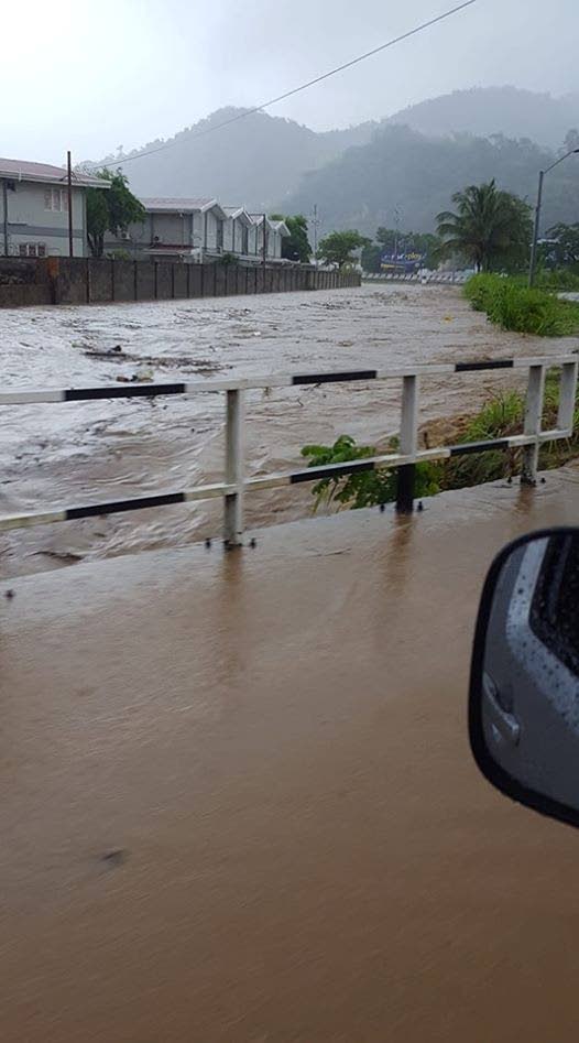 Flood waters rise as the Maraval River burst its banks yesterday. PHOTO VIA TT WEATHER CHANNEL’S FACEBOOK PAGE 