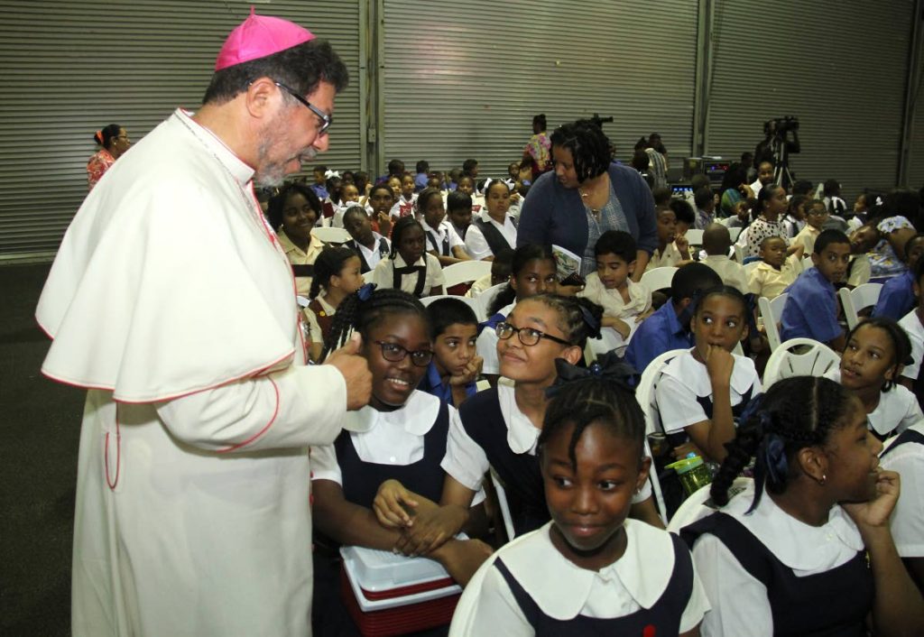 BLESSINGS: Archbishop Jason Gordon speaks to students of St Charles’ Girls RC School yesterday at the first Antilles Episcopal Conference at the Centre of Excellence in Macoya. PHOTO BY AYANNA KINSALE