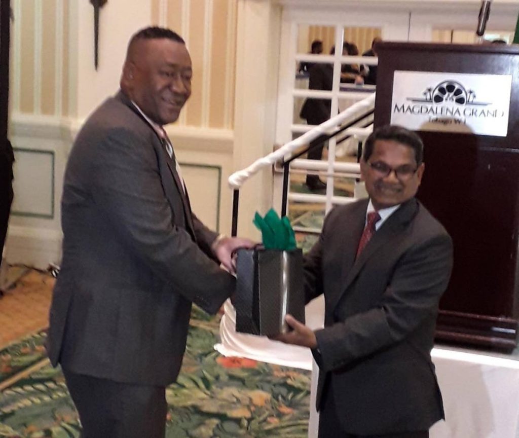 President of the Tobago Chamber of Commerce Martin George, left, presents new Indian High Commissioner to TT Arun Kumar Sahu with a gift during a cocktail reception in Sahu's honour at the Magdalena Grand Beach & Golf Resort, Lowlands.