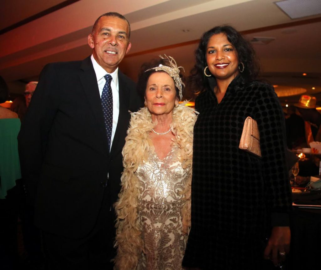 Former president Anthony Carmona and his wife Reema with Hannah Janoura at Janoura's  charity wine and cheese cocktail reception at MovieTowne Banquet and Conference Centre at Invader’s Bay, Port of Spain on  Friday night.
