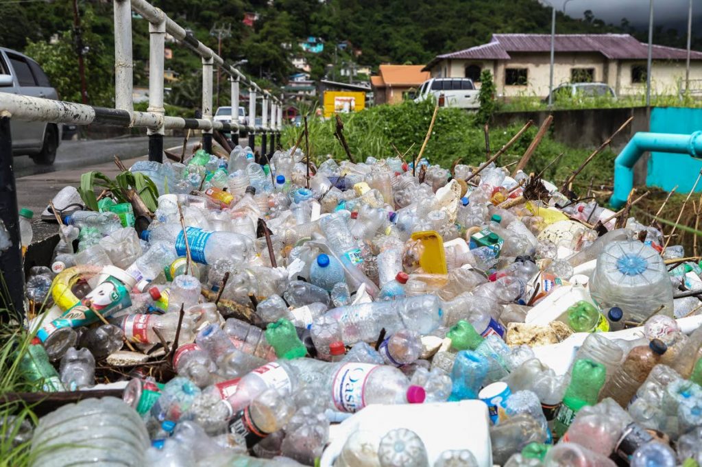 This September 2019 file photo shows a pile of plastic bottles near the Diego Martin river, Sierra Leone Road a week after the area was flooded.  