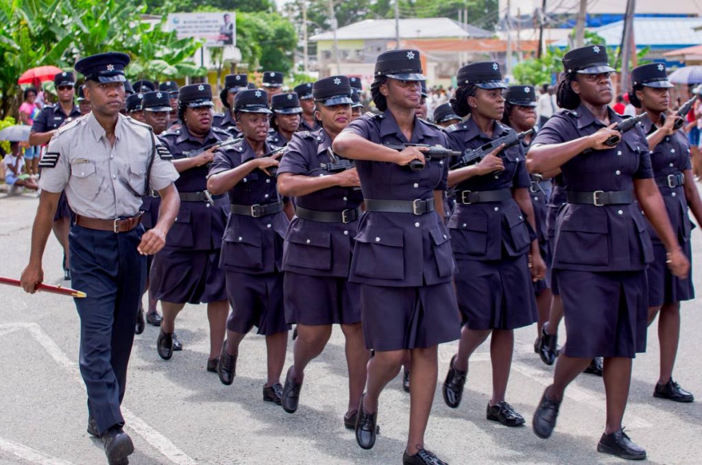 Female police officers march with their weapons at the Republic Day parade on Tuesday. 