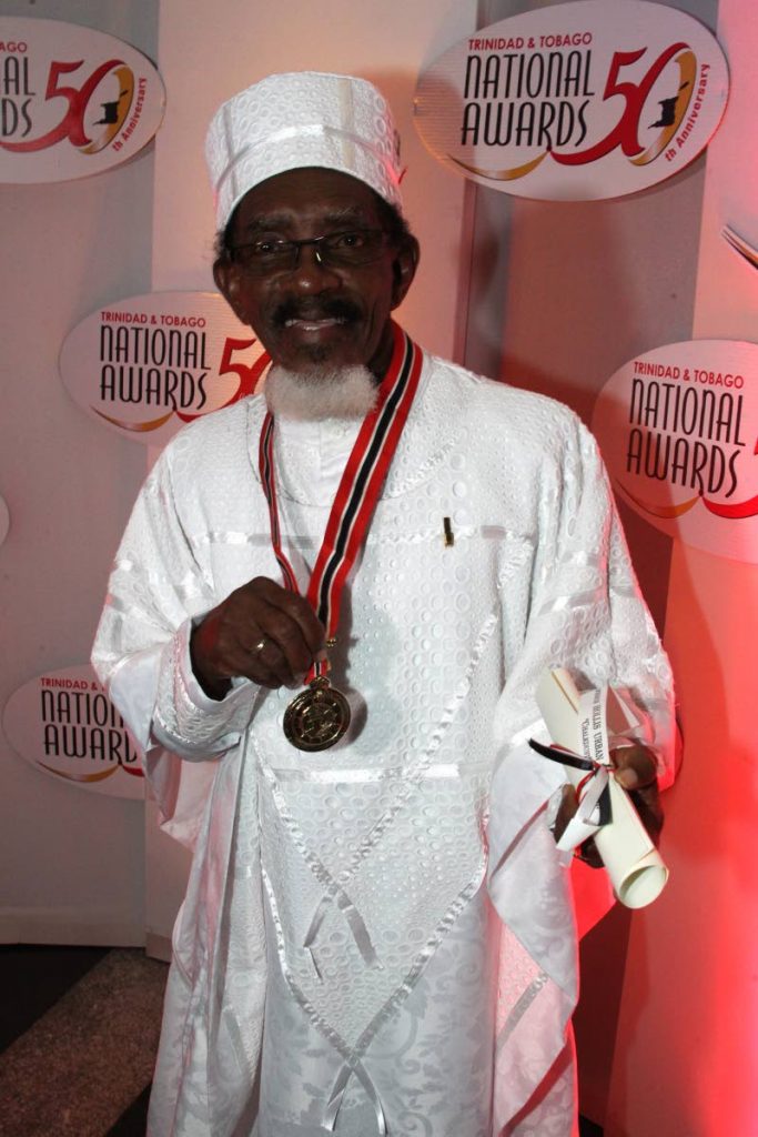 ICON OF CALYPSO: Veteran calypsonian and educator Hollis “Chalkdust” Liverpool with the Order of the Republic of Trinidad and Tobago which he received last night at the National Awards ceremony at NAPA, Port of Spain. PHOTO BY ROGER JACOB