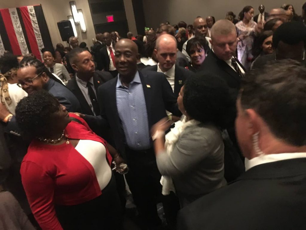 ROCKSTAR ROWLEY: Prime Minister Dr Keith Rowley is thronged by supporters from the diaspora at a Republic Day meeting in Brooklyn, New York on Tuesday night.  PHOTO BY CARLA BRIDGLAL